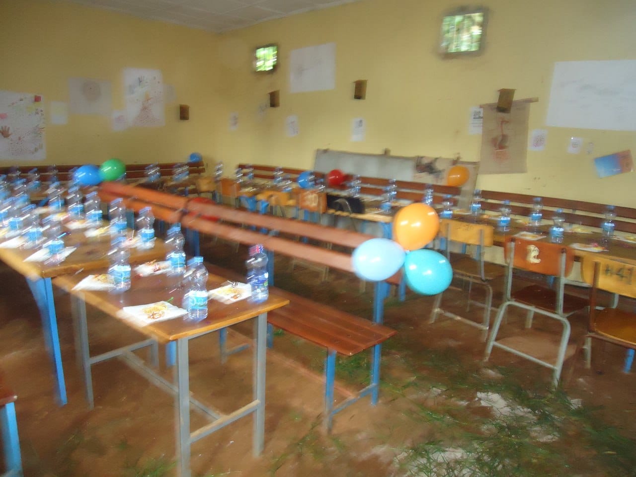 Classroom tables set with water and food