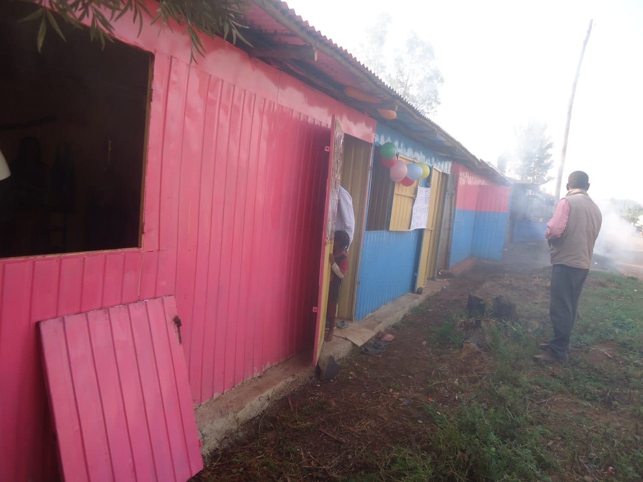 A row of newly painted container shops